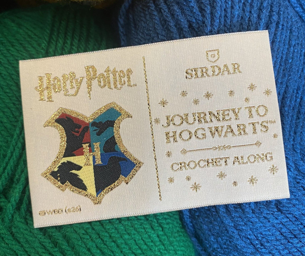 Woven Harry Potter Journey to Hogwarts Crochet Along blanket label with house crest