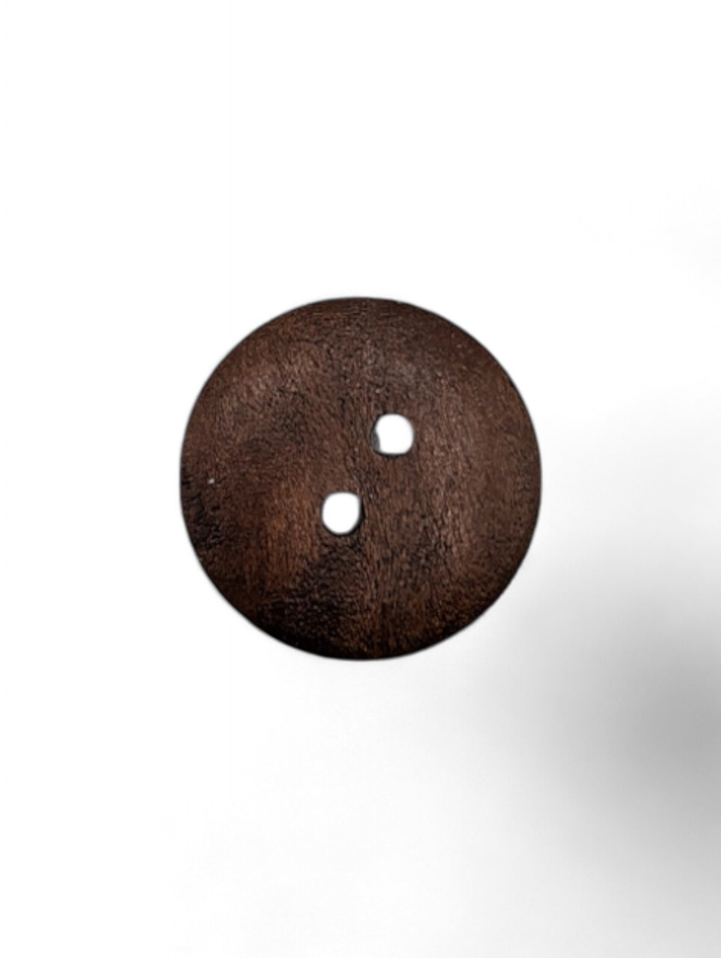 Craft button for sewing in brown - scale reference