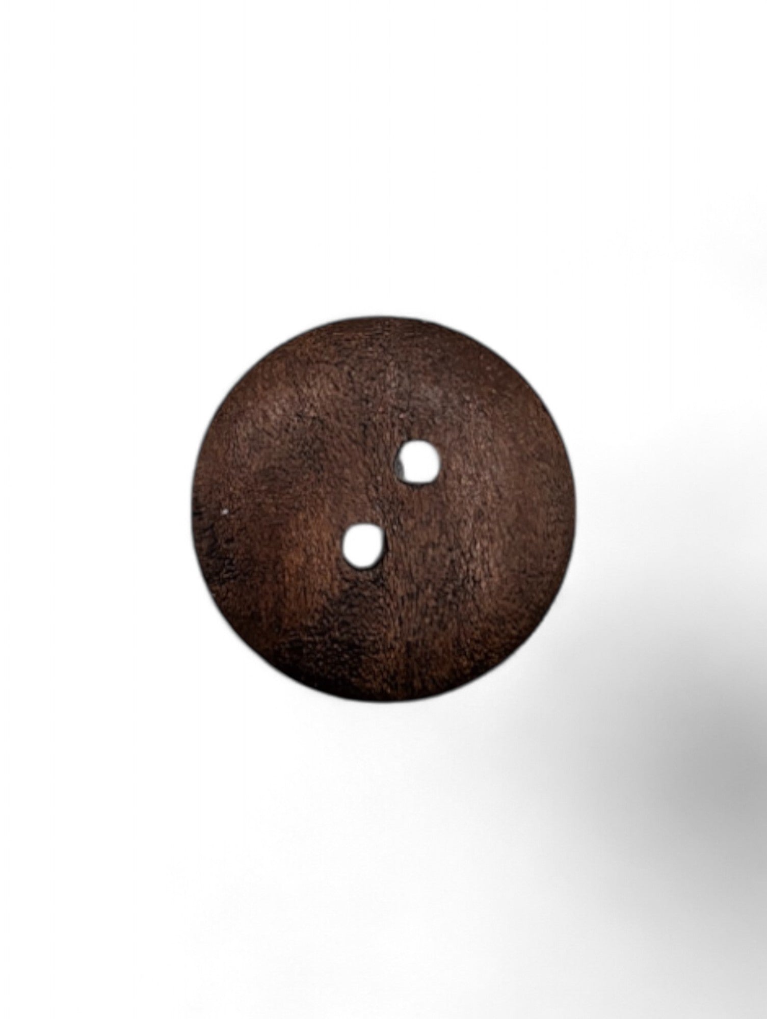 Craft button for sewing in brown - scale reference