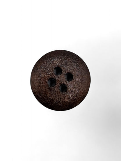 Craft button for sewing in brown - close up detail