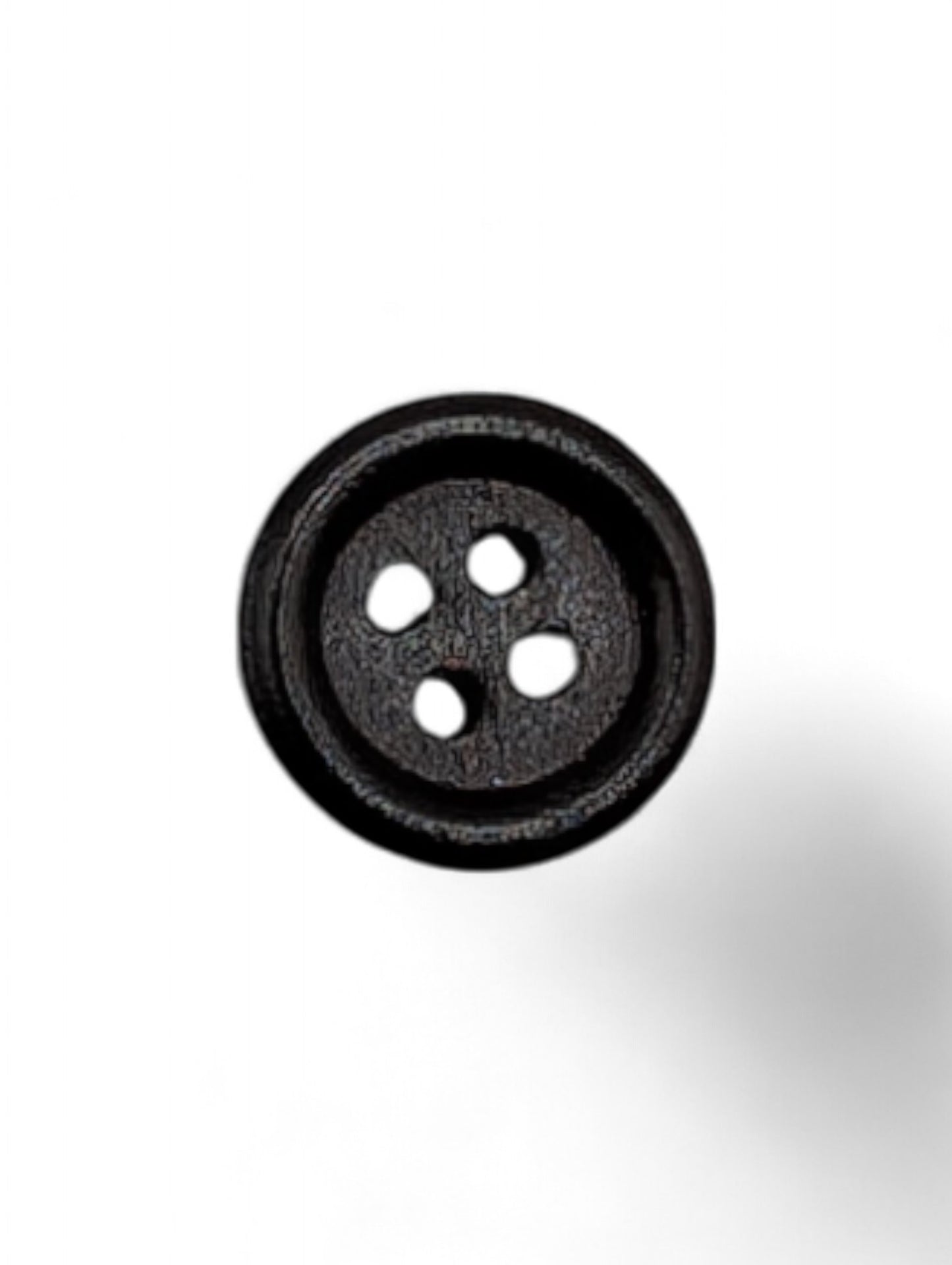 Craft button for sewing in brown - texture detail