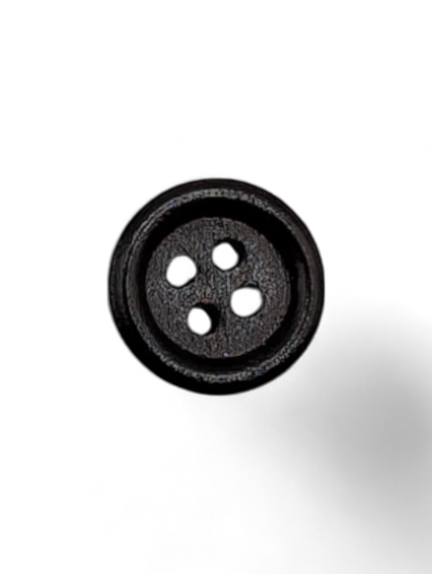 Craft button for sewing in brown - texture detail